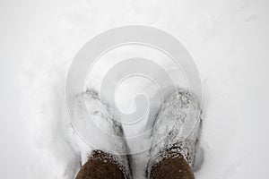 The felt boots covered in white snow
