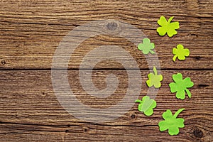 Felt clover leaves on old wooden background. Good luck symbol, St.Patrick`s Day concept