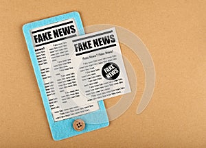 Felt craft smartphone with FAKE NEWS newspapers