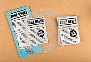 Felt craft smartphone with FAKE NEWS newspapers