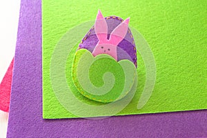 Felt Easter egg and bunny. How to make handmade Easter ornament. Sewing concept. Step