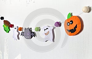 Felt garland for Halloween. Frankenstein, pumpkin, ghost, vampire and voodoo doll. Handmade fabric