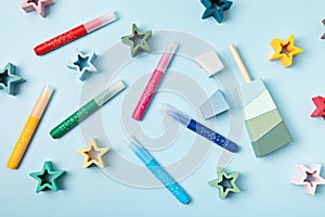 Felt pens and kids toys over blue background. Creative activities