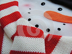 Felt snowman with knitted scarf for Christmas holidays.