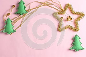 Felt toys and star decoration on a pink background. Flat lay, top view, mock up