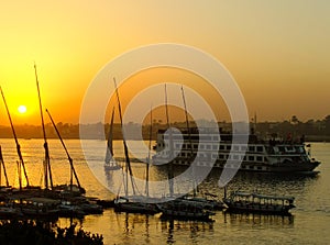 Felucca boats at the harbor at sunset, Luxor