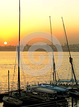 Felucca boats at the harbor at sunset, Luxor