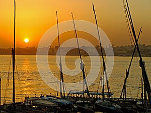 Felucca boats at the harbor at sunset, Luxor