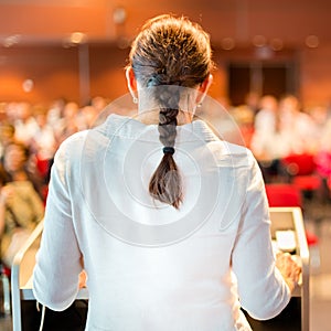 Female academic professor lecturing at faculty.