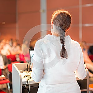 Female academic professor lecturing at faculty.