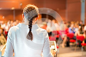 Female academic professor lecturing at faculty. photo