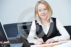 female accountant consultant with documents in office. Outsource Accounting and tax service. photo