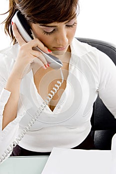 Female accountant talking on cell phone