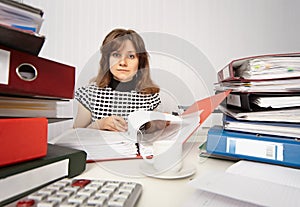 Female accountant very busy in office