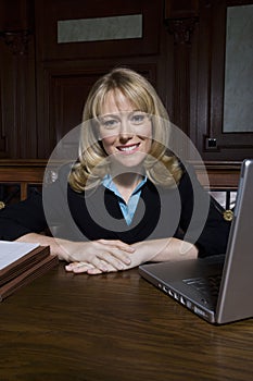 Female Advocate Sitting In Courtroom photo