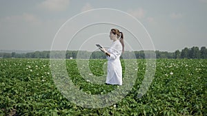 Female agronomist with digital tablet pc