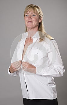 Female airline officer getting dressed