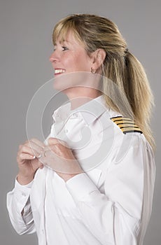 Female airline officer getting dressed