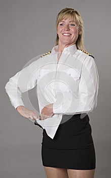 Female airline officer getting dressed