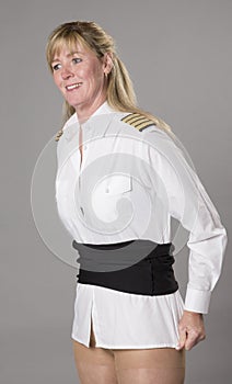 Female airline officer getting dressed