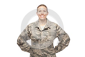 Female airman posing against white background photo