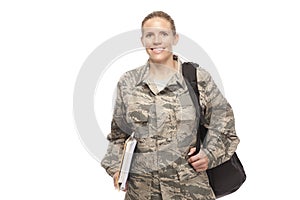 Female airman with shoulder bag and books photo