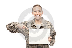 Female airman showing placard