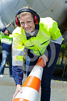 Female airport ground worker smiling