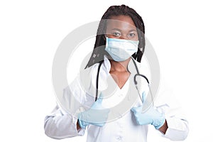 Female american african doctor, nurse woman wearing medical coat with stethoscope, mask and hand in gloves show like. Happy