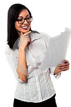 Female analyzing annual business reports