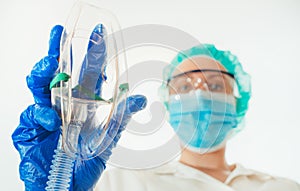 Female anesthesiologist giving mask