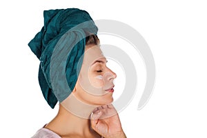 Female applying face moisturizer