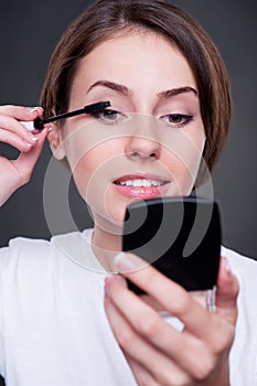 Female applying make-up