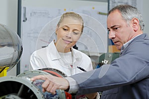 female apprentice being trained in aerospace workshop