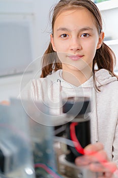 Female Apprentice working on CNC machinery