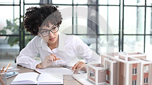 female architect designer examines house layout