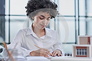 female architect designer examines house layout