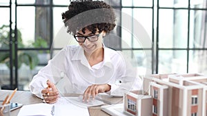 female architect designer examines house layout