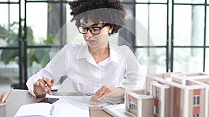 female architect designer examines house layout