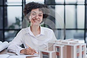 female architect designer examines house layout