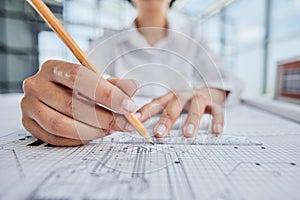 female architect designer working on blueprints