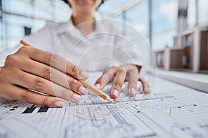 female architect designer working on blueprints