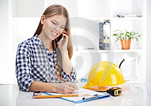 Female architect with phone