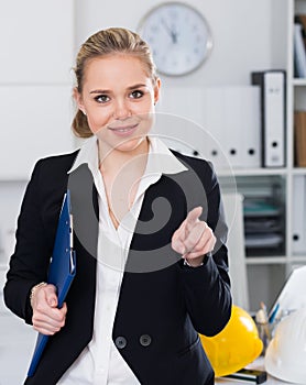 Female architect pointing at something