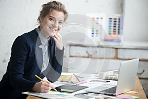 Female architect posing in office