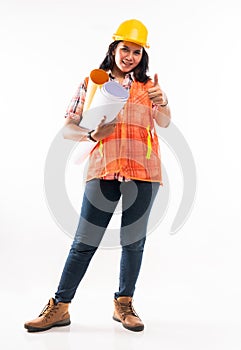 a female architect standing with thumb up and bring the paperworks photo