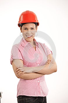 Female architect standing with arms crossed