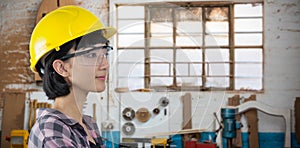 Composite image of female architect wearing hard hat and safety glasses against white background