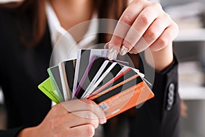 Female arm hold bunch of credit cards