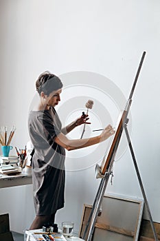 Female artist in her spacious white studio